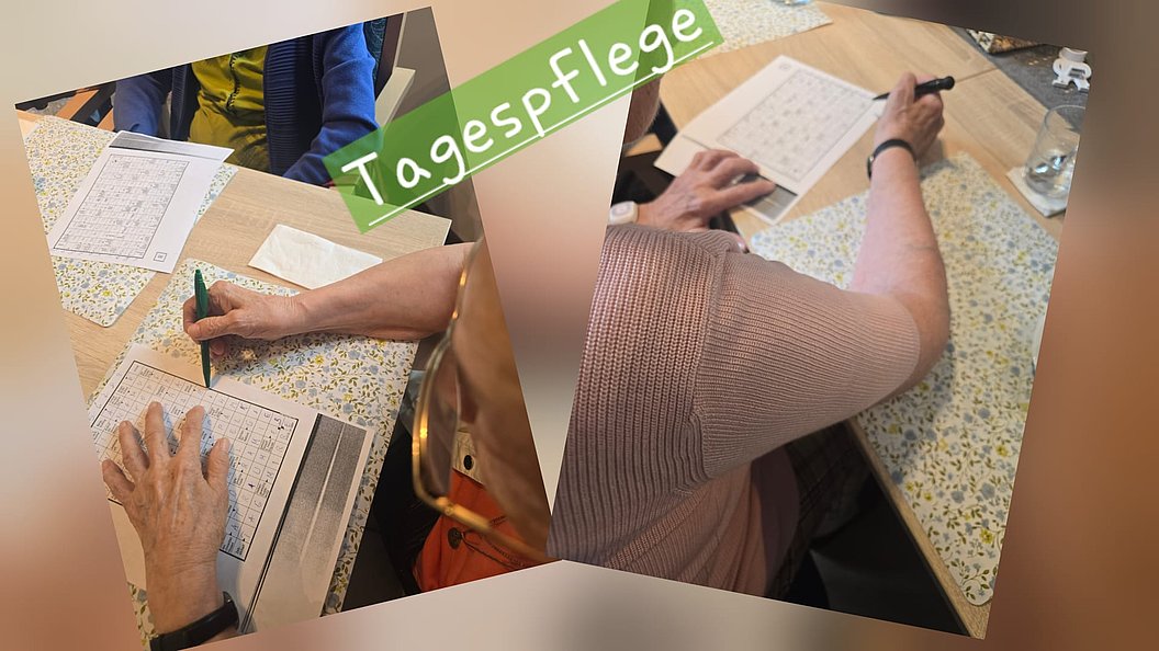 Aktivitäten in der Tagespflege: Senioren beim Ausfüllen von Kreuzworträtseln auf einem Tisch.